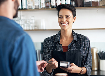 Business woman accepting card payment