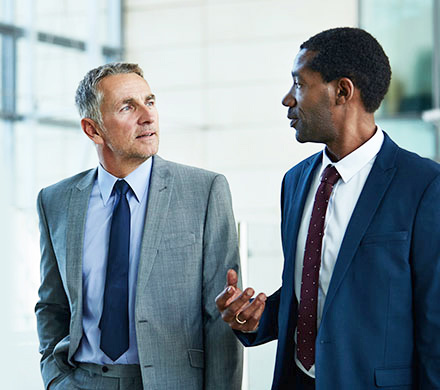 Two men in suits in building