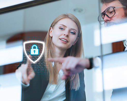 Business man and woman pointing to a lock and shield superimpossed over the image