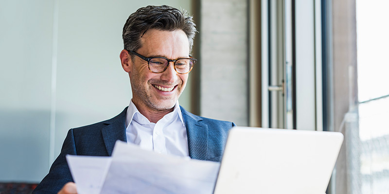 Business man reviewing paperwork