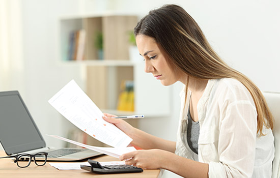 Woman reviewing bills
