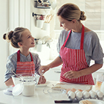 Mom cooking with child